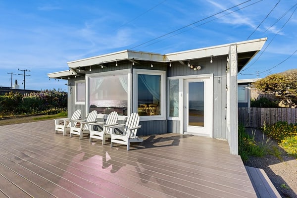 Wake to the sound of crashing waves from this oceanfront perch above Carmet Beach. Your dog will love exploring the coastal trails while you soak in panoramic Pacific views from the deck's Adirondack chairs. This bright 2-bedroom cottage sleeps 6 and sits directly across from the beach. Spud Point's famous crab sandwiches are 3 miles south, Terrapin Creek's acclaimed bistro is 2.7 miles away. Watch the sunset paint the sky from your front-row seat to nature's daily spectacle.