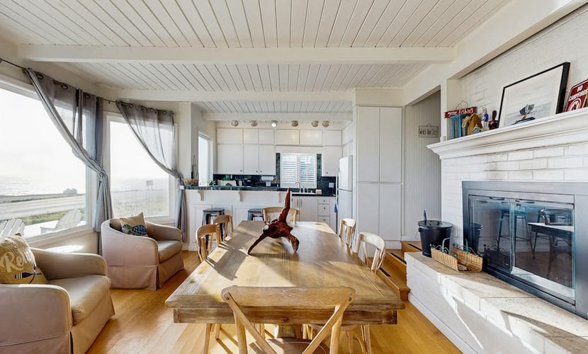 Wake to the sound of crashing waves from this oceanfront perch above Carmet Beach. Your dog will love exploring the coastal trails while you soak in panoramic Pacific views from the deck's Adirondack chairs. This bright 2-bedroom cottage sleeps 6 and sits directly across from the beach. Spud Point's famous crab sandwiches are 3 miles south, Terrapin Creek's acclaimed bistro is 2.7 miles away. Watch the sunset paint the sky from your front-row seat to nature's daily spectacle.