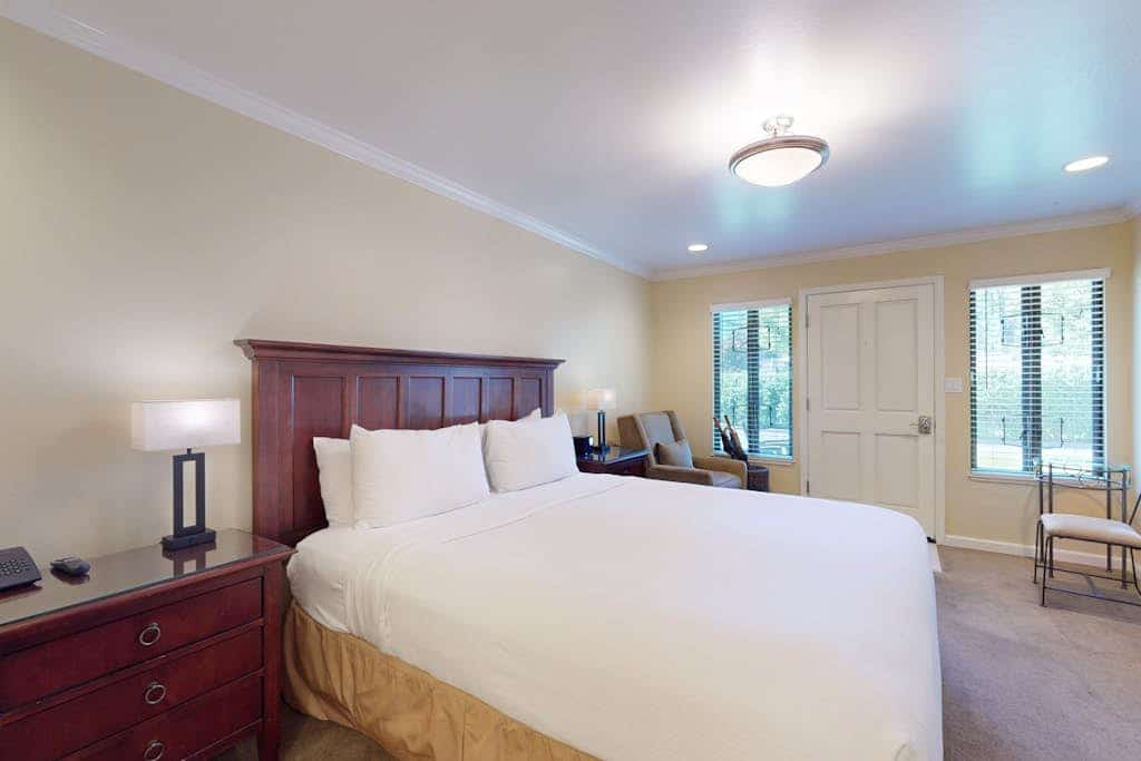 Morning light catches the fairway from the armchair by your window — coffee first, then the Silverado Trail's tasting rooms (Del Dotto, Whetstone, Krupp Brothers all under a mile). This upscale studio pairs a California king with a private patio for the evening's last pour, plus a kitchenette for the in-between hours. The resort's Market & Bakery is a 2-minute walk; the shared pool is steps away. Championship golf out the window, world-class wine out the door.