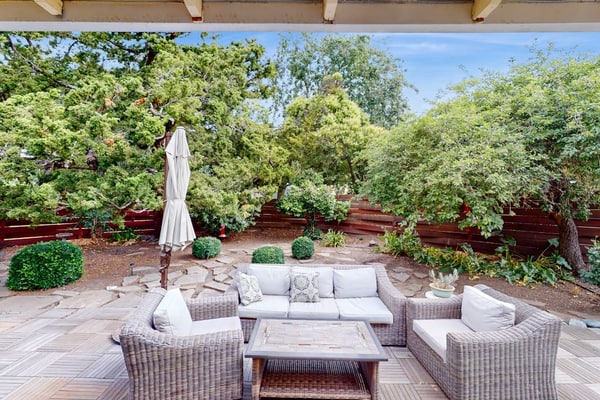Sip morning coffee in the sun-filled breakfast nook of this renovated 1950s ranch on a quiet Santa Rosa corner lot, then point the car toward Russian River Valley, Dry Creek, Alexander Valley, or Sonoma Valley tasting rooms — all within reach. Two bedrooms sleep 4 between a king and a queen, with two full baths, a private tree-shaded patio, and central AC for the warm afternoons home.
