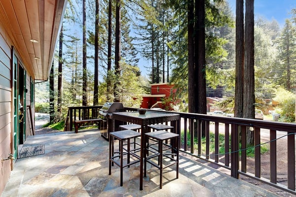 Sink into your private hot tub as redwoods tower overhead, their scent mingling with the woodsmoke from neighboring chimneys. This coral-colored A-frame welcomes you and your pup with contemporary comfort wrapped in classic cabin charm. Room for 6 in two bedrooms plus a sleeper sofa. Just 0.8 miles to Monte Rio Beach and 0.2 miles to Northwood Restaurant. The Russian River's unhurried rhythm sets the pace here — kayaking, golf, and riverside dining all within minutes.