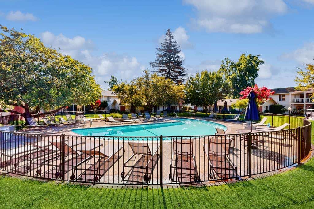 Two adjoining ground-floor condos in the heart of Silverado Resort sleep 4 across two king suites, each with its own entrance and bathroom — ideal for two couples who want shared evenings and private mornings. Unit 271 is the hub, with a full galley kitchen, king master, and two patios (one fully enclosed, one facing the driving range and the peaks); Unit 272 is a private studio suite with mini-kitchen. The seasonal pool is steps away; Del Dotto, Whetstone, and Krupp Brothers are less than a mile up the Silverado Trail.