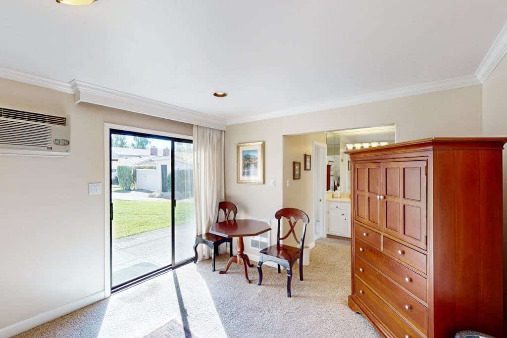 Two adjoining ground-floor condos in the heart of Silverado Resort sleep 4 across two king suites, each with its own entrance and bathroom — ideal for two couples who want shared evenings and private mornings. Unit 271 is the hub, with a full galley kitchen, king master, and two patios (one fully enclosed, one facing the driving range and the peaks); Unit 272 is a private studio suite with mini-kitchen. The seasonal pool is steps away; Del Dotto, Whetstone, and Krupp Brothers are less than a mile up the Silverado Trail.