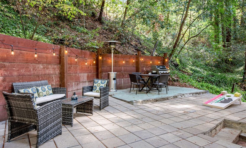Spiral up to your loft bedroom as sunlight filters through towering redwoods outside every window. This modern canyon hideaway sleeps 6 with three queen beds, a well-equipped kitchen, and a multi-level patio perfect for grilling under string lights. Just 0.3 miles from Rio Nido Roadhouse, 1.6 miles to Armstrong Redwoods trails, and 2 miles to downtown Guerneville's riverside scene. Your Russian River adventure starts where the forest meets comfort.