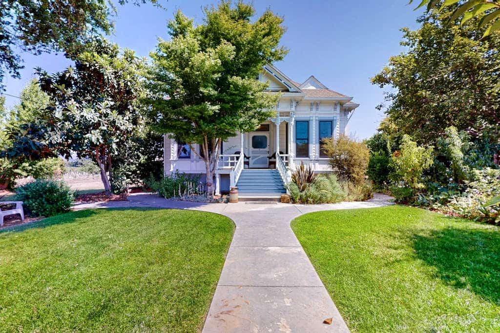 An 1895 Victorian turret door opens to wine country magic at this Magnolia Ranch cottage. Sip morning coffee on the gingerbread-trimmed porch as vineyard rows stretch to distant mountains. This colorful 2-bedroom retreat sleeps 4 amid crown molding and original hardwood floors. Just 1.3 miles from Healdsburg Plaza's tasting rooms and SingleThread. Set on a working vineyard, you'll enjoy the authentic Alexander Valley wine country experience.