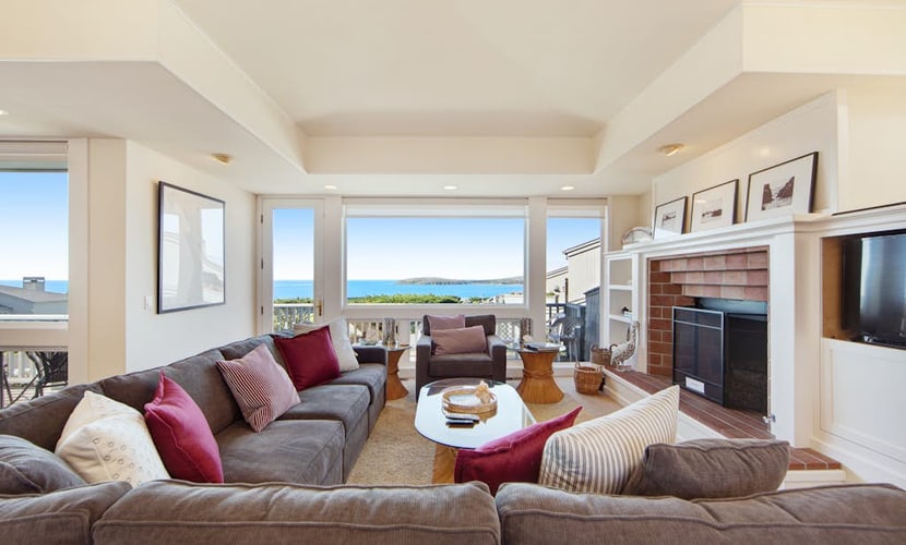 Feel the salt breeze drift across the fairway as you soak in your private hot tub, watching the sun sink into Bodega Bay. This contemporary three-bedroom retreat perches above The Links at Bodega Harbour with sweeping views of ocean, bay, and manicured greens. Room for eight in comfort. Just half a mile from the Pinnacle Gulch Trail and two miles from Doran Beach's protected sands. Your deck becomes the best seat on the Sonoma Coast — where golf course elegance meets wild Pacific beauty.