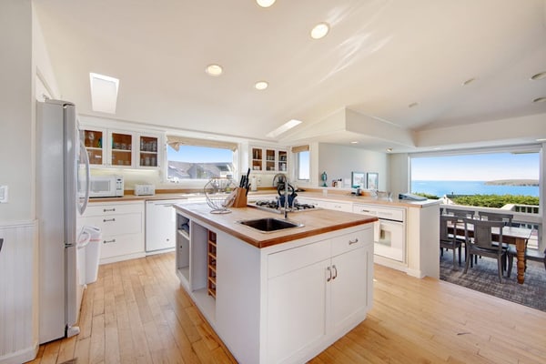 Feel the salt breeze drift across the fairway as you soak in your private hot tub, watching the sun sink into Bodega Bay. This contemporary three-bedroom retreat perches above The Links at Bodega Harbour with sweeping views of ocean, bay, and manicured greens. Room for eight in comfort. Just half a mile from the Pinnacle Gulch Trail and two miles from Doran Beach's protected sands. Your deck becomes the best seat on the Sonoma Coast — where golf course elegance meets wild Pacific beauty.