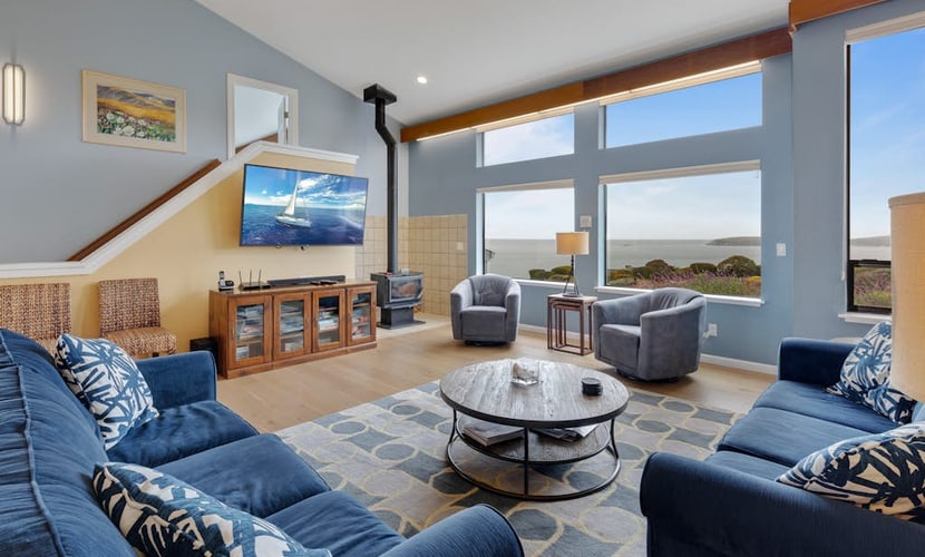 Feel the salt breeze from your private hot tub as the sun sets over the Pacific. This three-story contemporary retreat in Bodega Harbour sleeps 6 in three king suites, each with its own smart TV and luxe bedding. The expansive deck hosts dinner for 10 under the stars. Just 1.4 miles from Doran Beach and 2.3 miles from the headland's whale watching trails. Pour a glass of local wine, sink into the bubbling water, and let the ocean rhythms reset your pace.