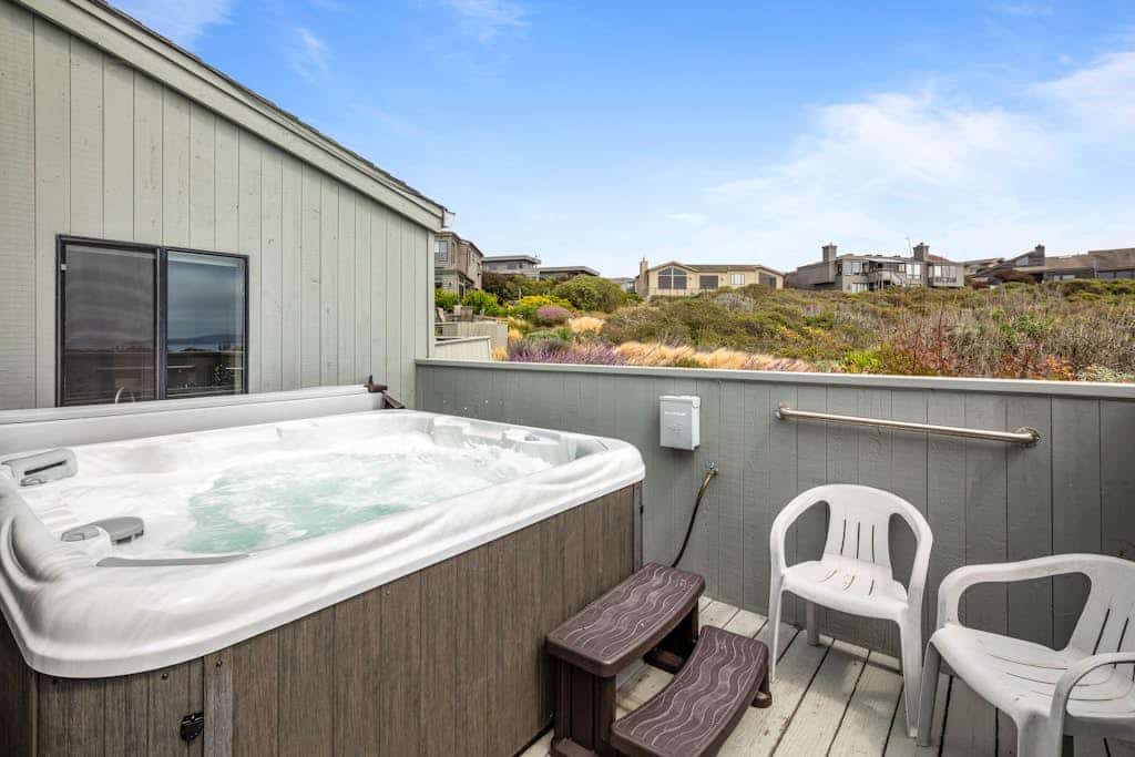 Feel the salt breeze from your private hot tub as the sun sets over the Pacific. This three-story contemporary retreat in Bodega Harbour sleeps 6 in three king suites, each with its own smart TV and luxe bedding. The expansive deck hosts dinner for 10 under the stars. Just 1.4 miles from Doran Beach and 2.3 miles from the headland's whale watching trails. Pour a glass of local wine, sink into the bubbling water, and let the ocean rhythms reset your pace.