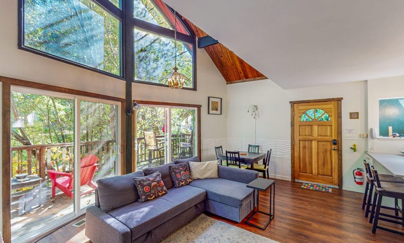 Austin Creek rushes past your deck at this whimsical cottage, where a sleeping loft and creative touches set the mood. Your dog will love exploring the fenced yard while you soak up the redwood-filtered light from colorful Adirondack chairs. This cheerful 2-bedroom retreat sleeps 4 and sits directly on the creek. Just 15 minutes from Guerneville's restaurants and 30 minutes from dramatic Salt Point State Park.