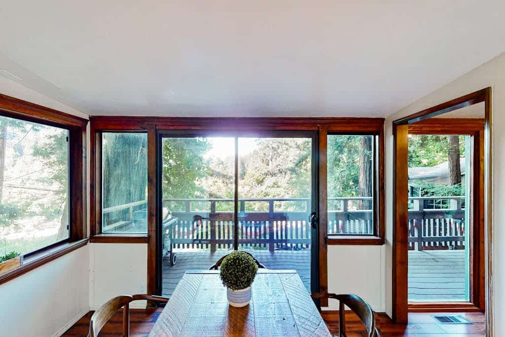 The Russian River glimmers through the trees below your hot tub at this dog-friendly Monte Rio lodge. This dog-friendly cottage perched above the water offers a gas fireplace and room for 4. Just 5 minutes from Guerneville's restaurants and 15 from the Sonoma Coast. Your deck becomes a front-row seat to river life — watch kayakers drift by as eagles soar overhead. This is Monte Rio magic: where time slows down and the river sets the pace.