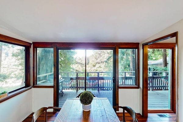 The Russian River glimmers through the trees below your hot tub at this dog-friendly Monte Rio lodge. This dog-friendly cottage perched above the water offers a gas fireplace and room for 4. Just 5 minutes from Guerneville's restaurants and 15 from the Sonoma Coast. Your deck becomes a front-row seat to river life — watch kayakers drift by as eagles soar overhead. This is Monte Rio magic: where time slows down and the river sets the pace.