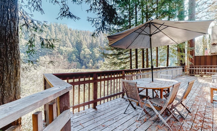 Redwood Lodge sleeps 4 adults across two bedrooms and a private loft sleeping area — with one of the bedrooms tucked off the garage for guests who'd rather have their own space. The wraparound deck looks out over the Russian River through redwood crowns. Steps from Northwood Golf Club, a mile from Monte Rio Beach, and dog-friendly. Out here, the only schedule that matters is sunrise and sunset.