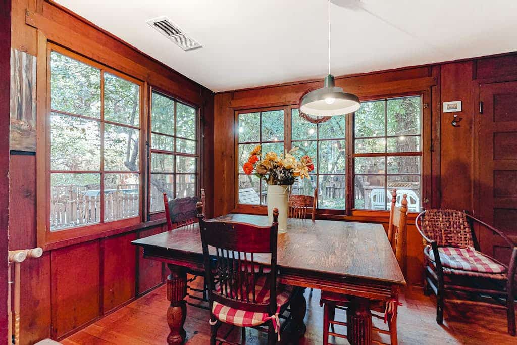 Wake to redwood light filtering across the deck of this dog-friendly cabin, a 3-minute walk from the neighborhood beach on the Russian River and 0.6 miles from downtown Guerneville. Soak in the private hot tub under the canopy, then warm up by the wood-burning fireplace inside. Two bedrooms and a twin sleep up to 5 in original clear-heart redwood rooms.