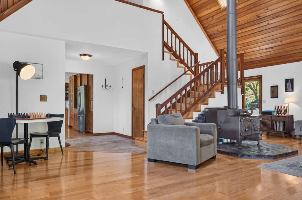 Light the wood stove, heat the spa whenever you like (free year-round), and let the redwoods do the rest — this Sebastopol hilltop home is built for cozy-season gatherings and up to four dogs. A wood-burning stove, a dining table for up to 10 (plus a round living-room table for 6 to 8 more), and a game room stocked with foosball and board games keep everyone happy when the weather turns. A chef's kitchen with espresso machine, fondue set, and popcorn popper means slow mornings and long dinners in. Sleeps 8 in four bedrooms. Marimar Estate 0.7 mi away.