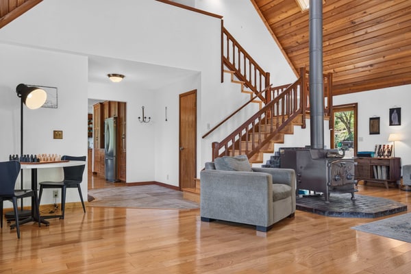 Light the wood stove, heat the spa whenever you like (free year-round), and let the redwoods do the rest — this Sebastopol hilltop home is built for cozy-season gatherings and up to four dogs. A wood-burning stove, a dining table for up to 10 (plus a round living-room table for 6 to 8 more), and a game room stocked with foosball and board games keep everyone happy when the weather turns. A chef's kitchen with espresso machine, fondue set, and popcorn popper means slow mornings and long dinners in. Sleeps 8 in four bedrooms. Marimar Estate 0.7 mi away.