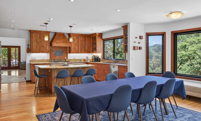 Light the wood stove, heat the spa whenever you like (free year-round), and let the redwoods do the rest — this Sebastopol hilltop home is built for cozy-season gatherings and up to four dogs. A wood-burning stove, a dining table for up to 10 (plus a round living-room table for 6 to 8 more), and a game room stocked with foosball and board games keep everyone happy when the weather turns. A chef's kitchen with espresso machine, fondue set, and popcorn popper means slow mornings and long dinners in. Sleeps 8 in four bedrooms. Marimar Estate 0.7 mi away.