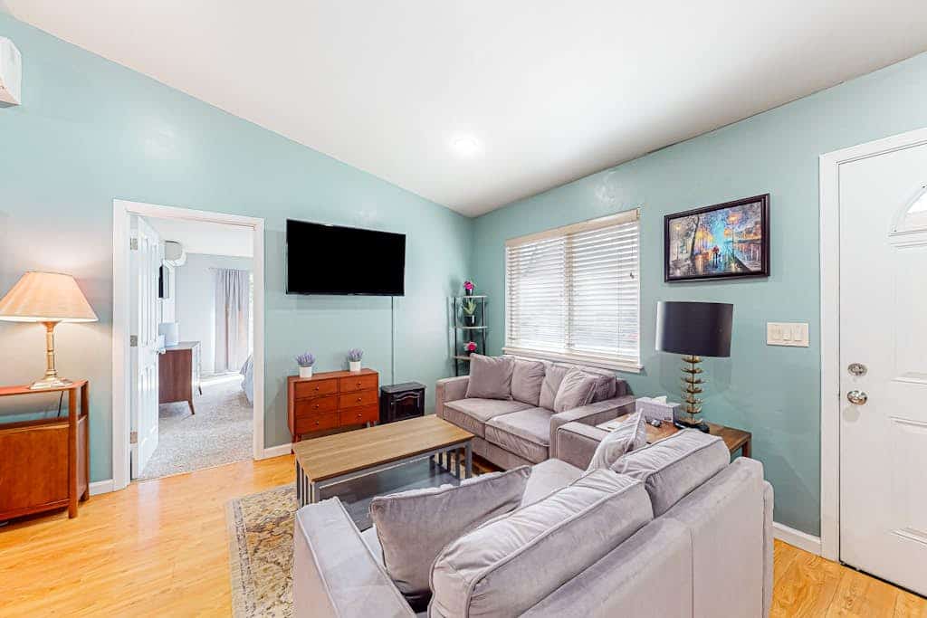 Walk half a mile to downtown Guerneville's eclectic restaurants and Johnson's Beach from this dog-friendly home built in 2014 on Old River Road. Two bedrooms sleep 6, with mini-split AC in every room, multiple decks among the redwoods, and a gas grill for backyard dinners. Korbel Winery, Northwood Golf Course, and Armstrong Redwoods sit within three miles. Note: multiple stairs lead to the front door.