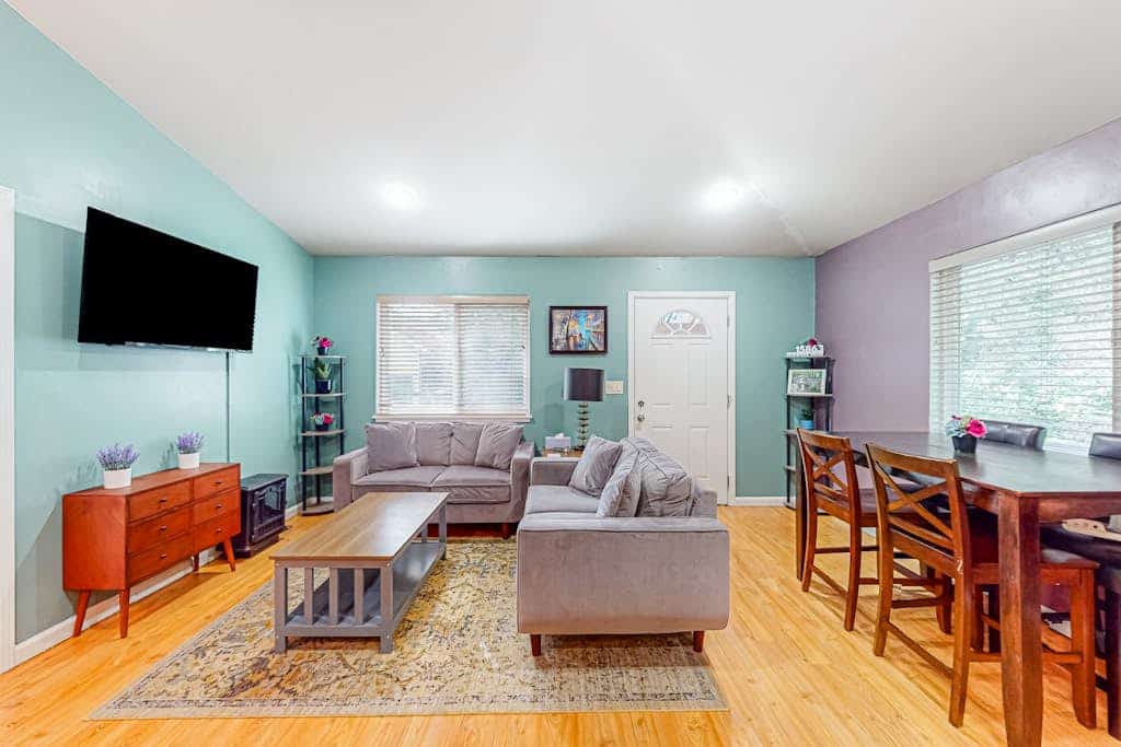 Walk half a mile to downtown Guerneville's eclectic restaurants and Johnson's Beach from this dog-friendly home built in 2014 on Old River Road. Two bedrooms sleep 6, with mini-split AC in every room, multiple decks among the redwoods, and a gas grill for backyard dinners. Korbel Winery, Northwood Golf Course, and Armstrong Redwoods sit within three miles. Note: multiple stairs lead to the front door.