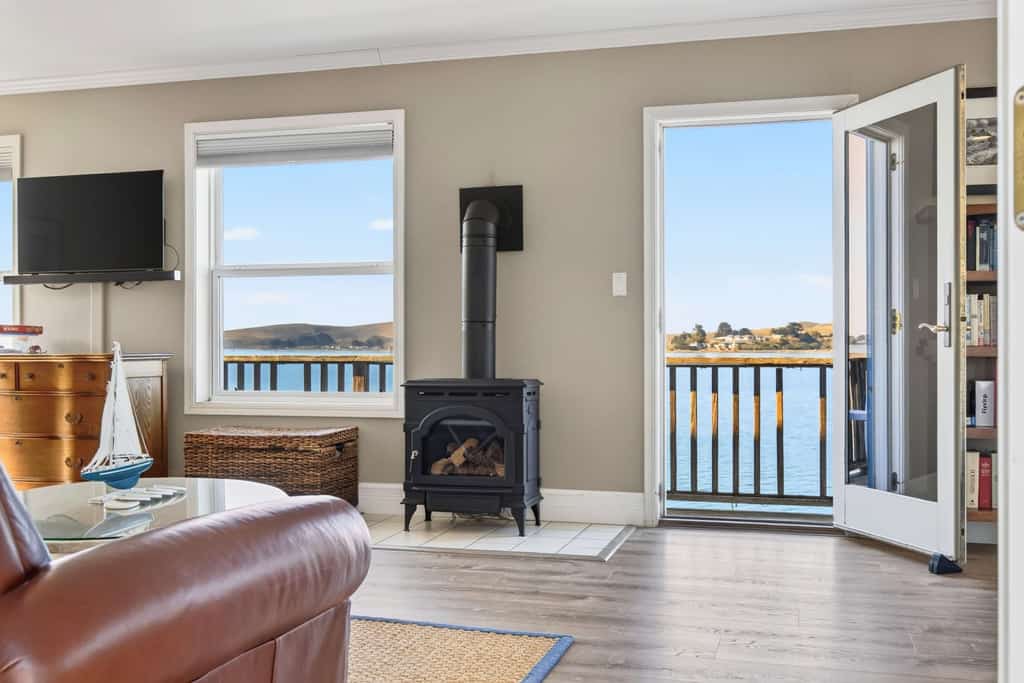 Wake to the cries of seabirds and watch fishing boats motor past from your waterfront perch. This intimate studio for two sits directly over Bodega Bay on weathered pilings — the water literally flows beneath you. Sip morning coffee on the narrow deck as harbor seals surface nearby. Just steps from Diekmann's Bay Store and The Boat House restaurant. An hour and a half from San Francisco, you'll find the coastal reset you've been craving. 
