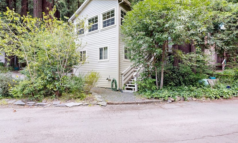 The scent of redwoods drifts through your windows as morning light filters through the forest canopy. Bring your dog to explore this unique retreat with its vintage knotty pine interiors and private fenced yard. Room for 4 across three distinct sleeping spaces. Just 200 feet from the Russian River and a 10-minute walk to downtown Guerneville's restaurants and shops. Cozy up to the gas fireplace after floating the river — this is the forest escape you've been craving.