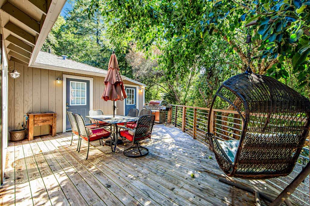 Wake to dappled orchard light through the bedroom's sliding glass door, step onto the deck with coffee, and point the day toward Russian River Valley AVA tasting rooms or a float at Steelhead Beach Regional Park 1.2 miles down the road. This dog-friendly Forestville home sleeps 4 between a king bedroom and a bunk room with four twins, with two decks, AC, WiFi, and a gas grill out back.