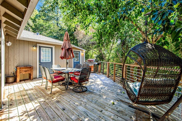 Wake to dappled orchard light through the bedroom's sliding glass door, step onto the deck with coffee, and point the day toward Russian River Valley AVA tasting rooms or a float at Steelhead Beach Regional Park 1.2 miles down the road. This dog-friendly Forestville home sleeps 4 between a king bedroom and a bunk room with four twins, with two decks, AC, WiFi, and a gas grill out back.
