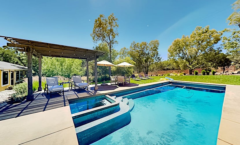 Slip into your private heated pool as the sun filters through ancient oaks on this secluded 5-acre estate. Your resort-style retreat features a spa, bocce court, and sprawling patio with grand outdoor fireplace — room for 5 in three bedrooms. Just 1.1 miles from Jack London State Historic Park and Glen Ellen Star's wood-fired kitchen. The heart of Sonoma Valley wine country surrounds you, yet total privacy awaits behind your gate.