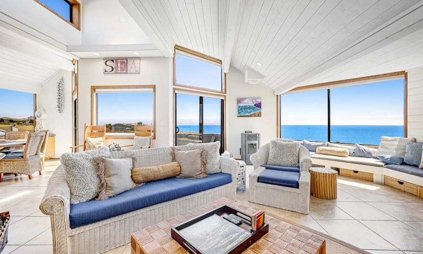 Wake to panoramic views of Bodega Bay stretching to the Pacific horizon from this hillside retreat. Soak under the stars in your private hot tub after exploring Doran Beach just across the street. This dog-friendly 5-bedroom home sleeps 10 — perfect for multi-generation gatherings. Walk to Pinnacle Gulch Trail (0.5 mi) or drive to Spud Point Crab Company (2.1 mi) for legendary crab sandwiches.