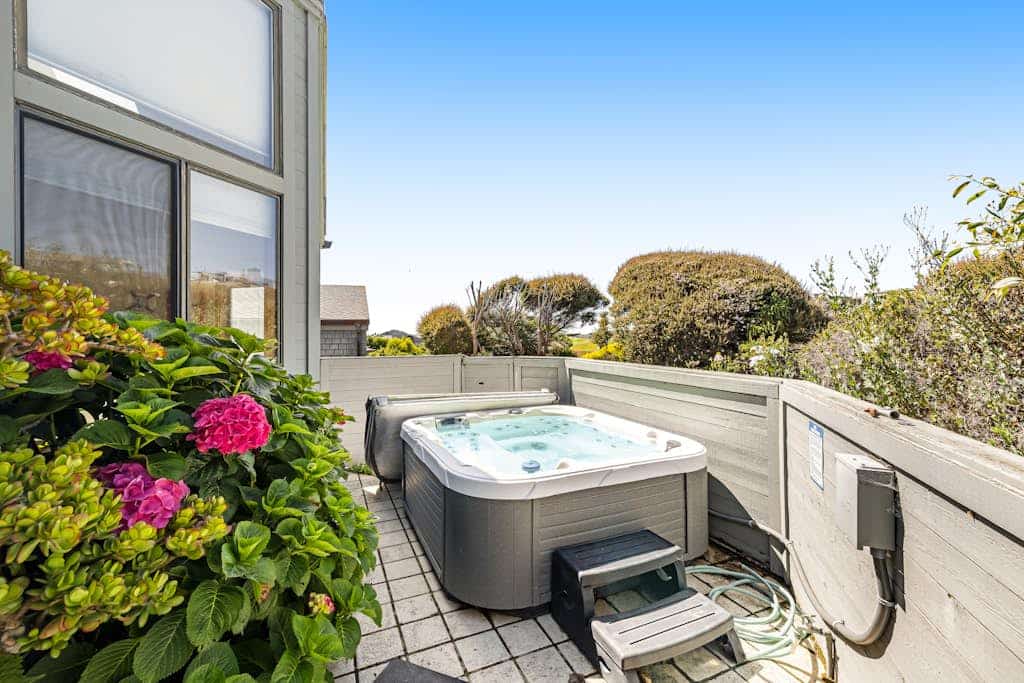 Wake to panoramic views of Bodega Bay stretching to the Pacific horizon from this hillside retreat. Soak under the stars in your private hot tub after exploring Doran Beach just across the street. This dog-friendly 5-bedroom home sleeps 10 — perfect for multi-generation gatherings. Walk to Pinnacle Gulch Trail (0.5 mi) or drive to Spud Point Crab Company (2.1 mi) for legendary crab sandwiches.