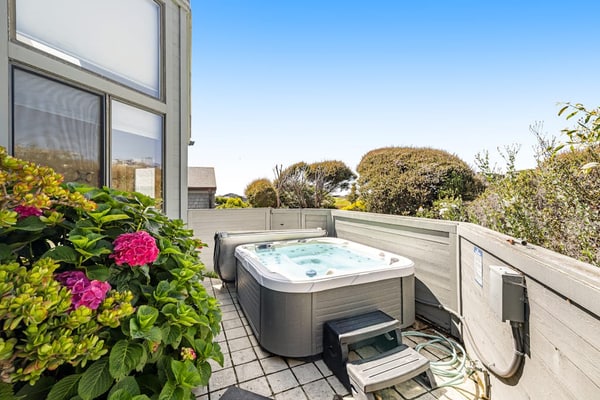Wake to panoramic views of Bodega Bay stretching to the Pacific horizon from this hillside retreat. Soak under the stars in your private hot tub after exploring Doran Beach just across the street. This dog-friendly 5-bedroom home sleeps 10 — perfect for multi-generation gatherings. Walk to Pinnacle Gulch Trail (0.5 mi) or drive to Spud Point Crab Company (2.1 mi) for legendary crab sandwiches.