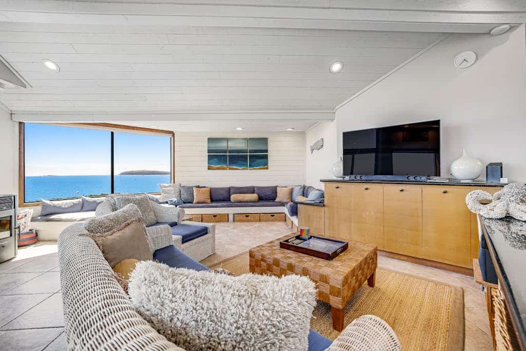 Wake to panoramic views of Bodega Bay stretching to the Pacific horizon from this hillside retreat. Soak under the stars in your private hot tub after exploring Doran Beach just across the street. This dog-friendly 5-bedroom home sleeps 10 — perfect for multi-generation gatherings. Walk to Pinnacle Gulch Trail (0.5 mi) or drive to Spud Point Crab Company (2.1 mi) for legendary crab sandwiches.