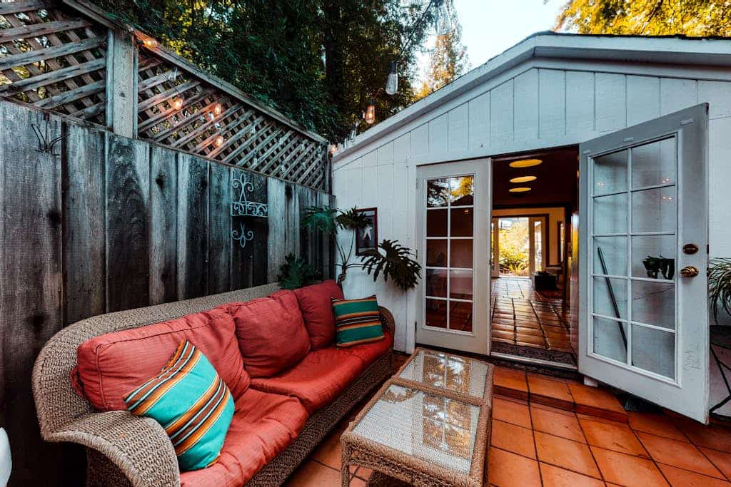 Step out the door into wine country — this dog-friendly cottage overlooks a picturesque vineyard yet sits a short walk from the Russian River, with Armstrong Redwoods 4.5 miles away. Two queen bedrooms plus a sofa bed sleep 6, and an open-air atrium connects the two buildings under a perfect view of the stars.
