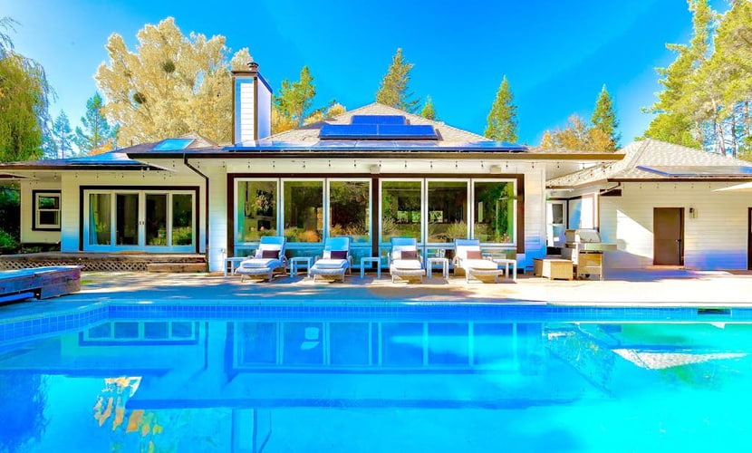 A 6-acre wine country compound with a heated pool, hot tub, private creek, and two buildings sleeping up to 14 across four bedrooms. The chef's kitchen, wood-burning fireplace, game room, and bocce court keep the group on-property as long as you want. Marimar Estate Vineyards is a third of a mile away; Graton's restaurants are five minutes; The Barlow and downtown Sebastopol are about 10 minutes by car.