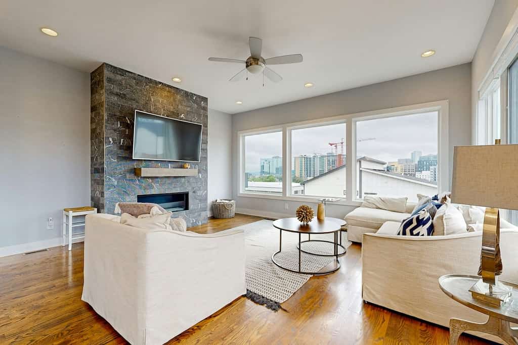 Modern 4-bedroom retreat with a private rooftop deck, city views, spacious living areas, gourmet kitchen, private 2-car garage, and convenient access to Downtown Nashville, The Gulch, Music Row, and 12South.