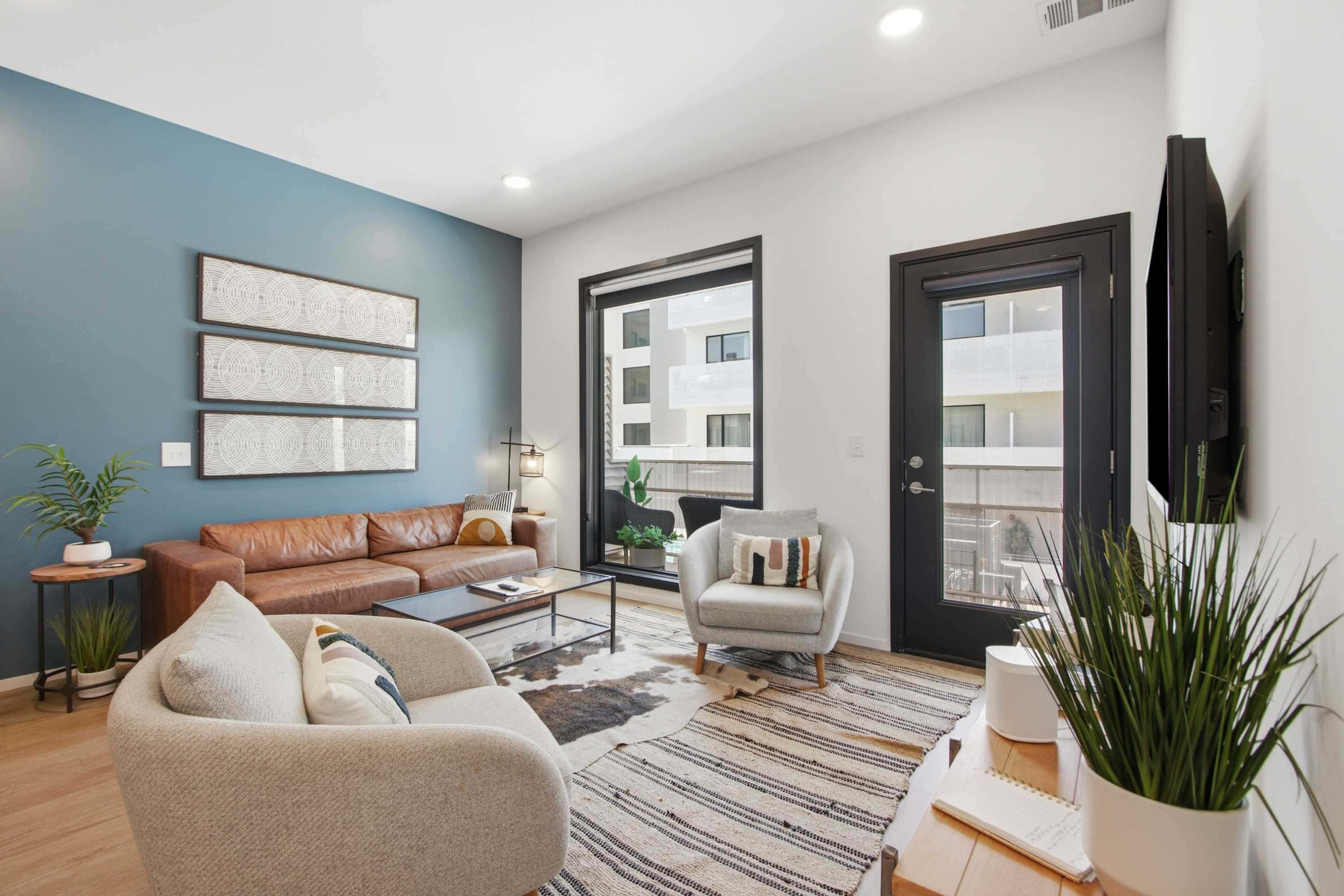 Modern condo near attractions with outdoor pool, balcony, central AC, and WiFi