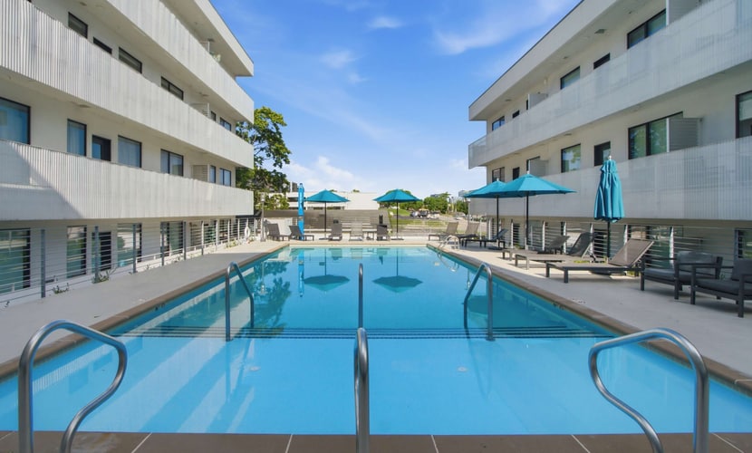 Stay in the heart of Nashville at Illume 223, a modern condo in the Gulch View area near The Gulch, Music Row, and Downtown. Relax on the private covered balcony overlooking the seasonal pool, stay active in the fitness center, and enjoy a full kitchen, smart TVs, Sonos speakers, and a private washer/dryer.