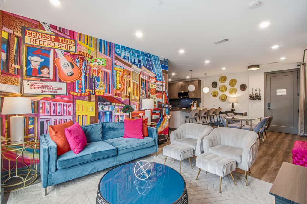 Stay at The Muse, a stylish 3-bedroom condo near downtown Nashville and Broadway. Sleeps up to 8 guests with a full kitchen, private balcony, fast WiFi, smart TVs, workspace, vinyl player, and Singtrix Karaoke. Enjoy building amenities including a rooftop lounge, fitness center, cornhole court, and elevator. A convenient home base for music lovers, families, groups, and business travelers.