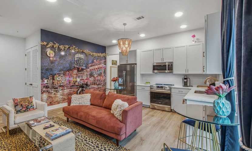 Stay in a stylish 2-bedroom condo in East Nashville, just 2.7 miles from Broadway and close to restaurants, bars, live music, and local attractions. Enjoy a modern kitchen, rooftop deck, fun selfie wall, fast WiFi, smart TVs, and an in-unit washer/dryer. With a king and queen bedroom, the condo comfortably sleeps up to 4 guests.