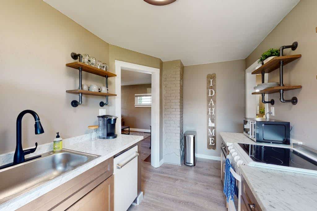 Two Private Cottages, One Shared Backyard—Perfect for Groups Who Want Space & Connection

Your private gateway to downtown Coeur d'Alene starts here: two fully independent side-by-side cottages with zero shared walls, each with its own kitchen, bathroom, and entrance. Sleep 8 guests across 3 bedrooms while maintaining the independence every group craves. Blocks from restaurants, under 15 minutes' walk to City Beach, and a shared fire pit where both families naturally gather each evening. This is group travel solved.