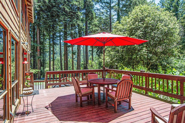 Soak in the hot tub as redwood shadows lengthen across the deck of this dog-friendly hillside home, ten minutes off the highway but a world away near Cazadero. Four bedrooms and three baths sleep eight, with a gas fireplace inside and a deck out back. Northwood Golf Club sits 8 miles down the road; Armstrong Redwoods and the Sonoma Coast are within a half-hour drive.