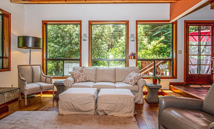 Soak in the hot tub as redwood shadows lengthen across the deck of this dog-friendly hillside home, ten minutes off the highway but a world away near Cazadero. Four bedrooms and three baths sleep eight, with a gas fireplace inside and a deck out back. Northwood Golf Club sits 8 miles down the road; Armstrong Redwoods and the Sonoma Coast are within a half-hour drive.