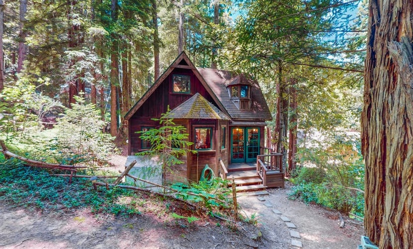 Wake to redwood light filtering across the deck of this dog-friendly A-frame cottage, four miles south of Cazadero, with a private hot tub waiting under the canopy. The 1-bedroom hideaway sleeps two between a queen loft and a quiet forest setting — the Russian River is seven miles down the road in Monte Rio, and Jenner's coast is a ten-mile scenic drive.