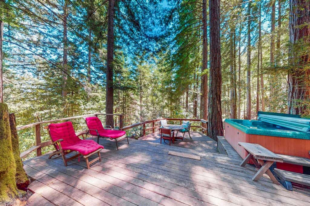 Wake to redwood light filtering across the deck of this dog-friendly A-frame cottage, four miles south of Cazadero, with a private hot tub waiting under the canopy. The 1-bedroom hideaway sleeps two between a queen loft and a quiet forest setting — the Russian River is seven miles down the road in Monte Rio, and Jenner's coast is a ten-mile scenic drive.