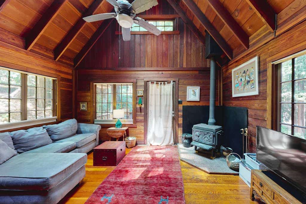 Wake to redwood light filtering across the deck of this dog-friendly A-frame cottage, four miles south of Cazadero, with a private hot tub waiting under the canopy. The 1-bedroom hideaway sleeps two between a queen loft and a quiet forest setting — the Russian River is seven miles down the road in Monte Rio, and Jenner's coast is a ten-mile scenic drive.