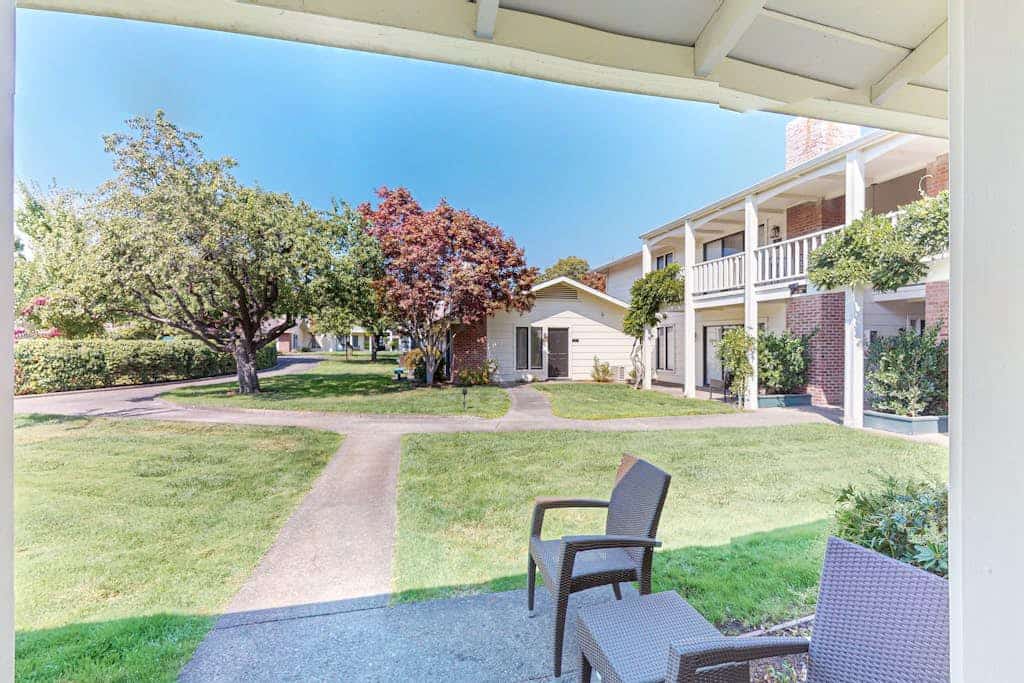 Your own ground-floor entrance opens onto a private covered patio overlooking Silverado's manicured lawns — coffee out there in the morning, a bottle from the day's tastings in the evening. Inside: a king bedroom with AC and smart TV, plus a kitchenette for the in-between hours. Heated community pool and hot tub steps away, EV charging on-site, and no resort fee. Darioush, Frog's Leap, and Duckhorn are minutes up the Silverado Trail; William Hill is a mile away.