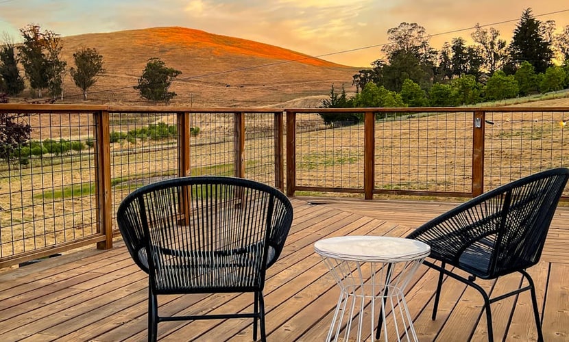 Golden hills unfold beyond the deck as you settle into this modern farmhouse on an 11-acre working ranch. A striking black-and-white palette and open floor plan give way to panoramic valley views — sheep grazing below, sunset painting the ridgeline. Penngrove puts you 10 minutes from Petaluma, 25 minutes from Sonoma Plaza, and within easy reach of every wine region in the county. Bring the dogs and let the quiet of ranch country settle in.