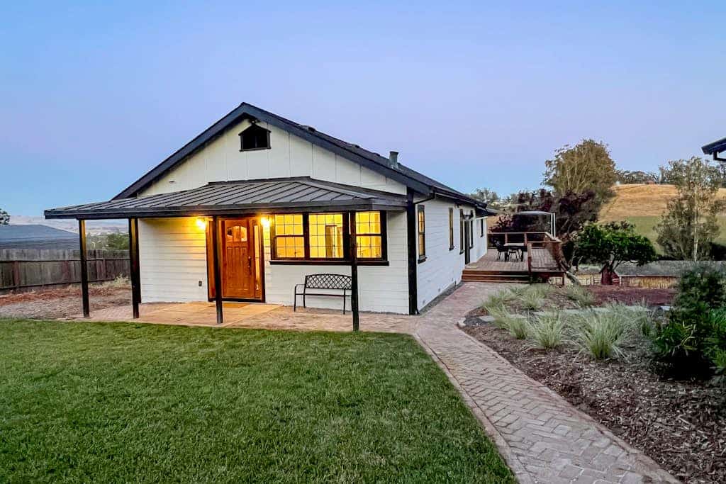 Golden hills unfold beyond the deck as you settle into this modern farmhouse on an 11-acre working ranch. A striking black-and-white palette and open floor plan give way to panoramic valley views — sheep grazing below, sunset painting the ridgeline. Penngrove puts you 10 minutes from Petaluma, 25 minutes from Sonoma Plaza, and within easy reach of every wine region in the county. Bring the dogs and let the quiet of ranch country settle in.