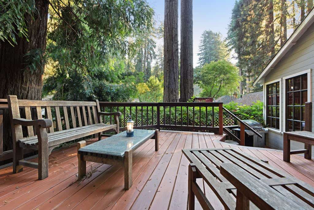 A stone hearth with a wood burning stove anchors this peaceful forest hideaway, where towering redwoods shade every window. Gather around the stone fireplace or grill dinner on the deck while kids play in the enclosed yard — this 2-bedroom cottage sleeps 4 comfortably. Just a 5-minute walk to a community beach with river access and a mile from Lightwave Coffee. Your days here move at redwood pace — slow, grounded, and deeply restorative among these ancient giants.
