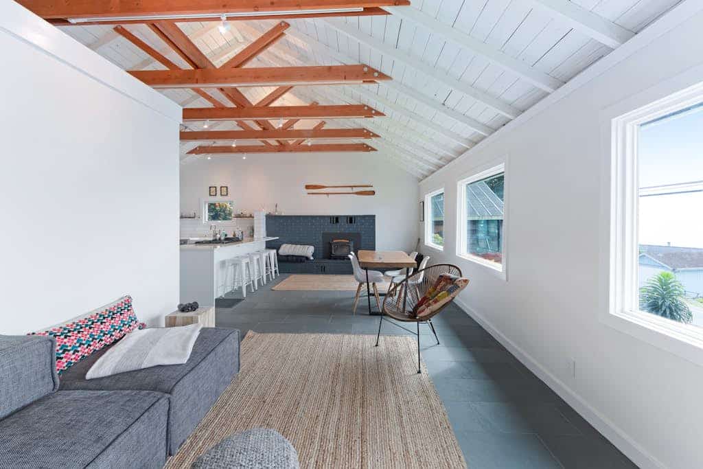 Eucalyptus and salt air fill the deck overlooking Bodega Harbor — surf breaks and dog-friendly beaches about a mile up or down Highway 1. This surf-inspired bungalow offers a private sauna for post-beach relaxation and space for four guests plus your dogs. Walk to Huria's Pizza in one minute or Spud Point Crab Company in 10. The harbor seals call from the rocks below — you're home on the Sonoma Coast.